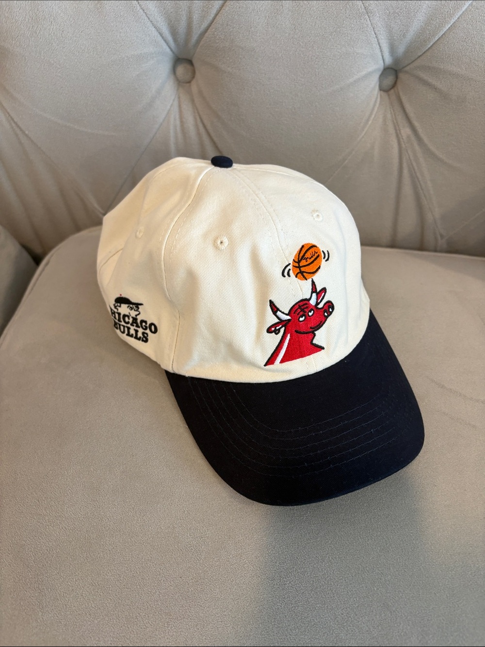 G/FORE White and Navy Two-Tone Baseball Cap with Red Bull Motif